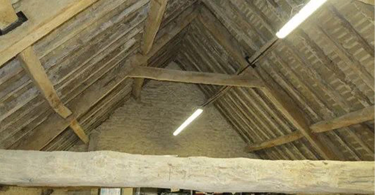 What are the statutory requirements that can derail the reroofing of heritage buildings?