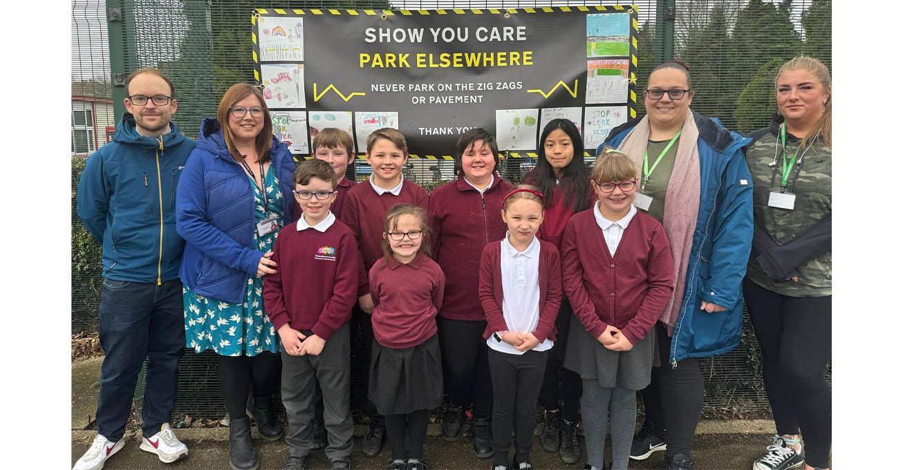 School pupils create posters to alert parents to the dangers of careless parking